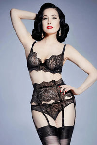 Dita Von Teese in black Lurex Lace G-String Panty, bra, and suspenders, featuring fine Leavers lace.