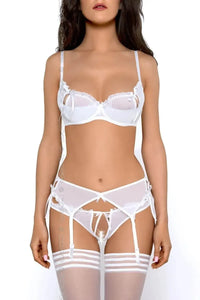 Sensual snow-white peek-a-boo shelf bra with exciting slits, delicate ruffles, sheer tulle, and matching garter set.