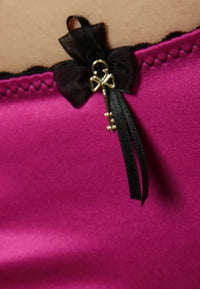 Seductively playful Raissa satin thong panty in vibrant pink with a black lace trim and delicate organza bow with a golden key charm.