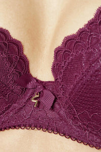 Burgundy Superboost Lace Foil Plunge Bra with a golden Gossard 'G' detail and bow, enhancing cleavage.